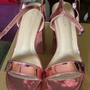 Moda Shiny Pink Platform Sandals
NWOB